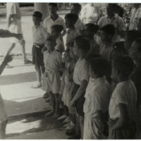 World War II. Malay. Civilian internees camp. Children choir.