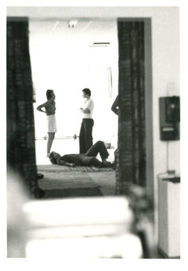 View through doorway of two women talking during self-defence classes at the Amazon Self-Defence ...