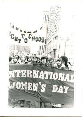 Alternate front view of people marching on International Women's Day