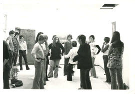 Women standing in semi-circle watching teacher during self-defence class at the Amazon Self-Defen...